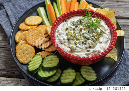 creamy yogurt pickles caper dill dip in red bowl creamy yogurt pickles caper dill dip in red bowl 124381321