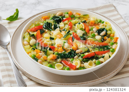 Vegetarian Minestrone with in white bowl, top view 124381324