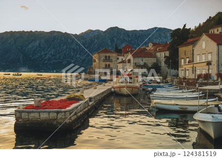 Scenic Mediterranean Harbor at Sunset in Coastal Village at the bay of Kotor 124381519