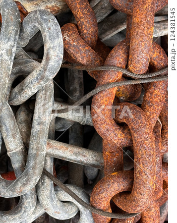 Rusty and Weathered Metal Chains Close-Up  124381545