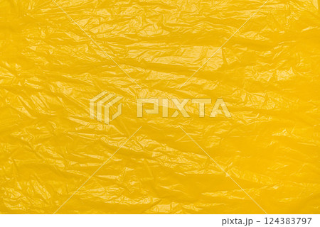 A textured yellow crumpled paper background with natural creases and folds. Ideal for design projects, digital graphics, or creative presentations requiring a vibrant. A textured yellow crumpled paper background with natural creases and folds. Ideal for design projects, digital graphics, or creative presentations requiring a vibrant. 124383797