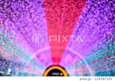 Colored decorative festive bokeh lights sparkle brightly. 124387105