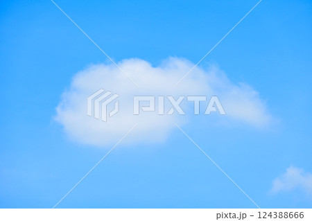 beautiful blue sky and white fluffy single cloud with sunrise in the morning, natural background beautiful blue sky and white fluffy single cloud with sunrise in the morning, natural background 124388666