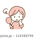 鏡を見て顔を曇らせる女性 124388799