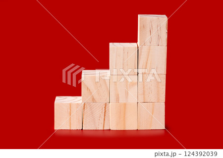 Wooden cubes on red 124392039