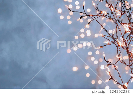 Blurred bokeh lights on dark grey, evoking a soft, subtle aesthetic 124392288