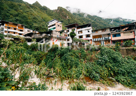 Aguas Calientes, Peru - dec 2, 2024 View of the Urubamba river through the Aguascalientes village Aguas Calientes, Peru - dec 2, 2024 View of the Urubamba river through the Aguascalientes village 124392867