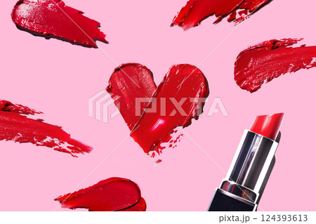 Red heart-shaped swatches. Red lipstick, white background. Pink lipstick glossy texture in heart shape. red smears swatches swipe 124393613