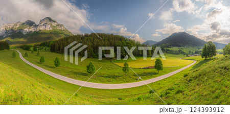 Meadow with road and bench during sunset in Berchtesgaden National Park Meadow with road and bench during sunset in Berchtesgaden National Park 124393912