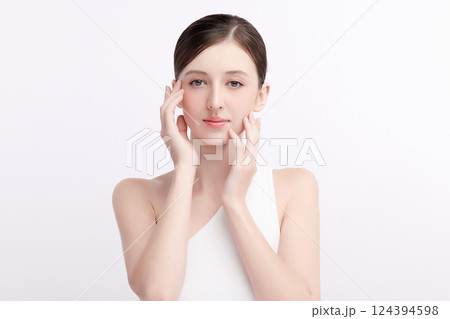 A beautiful young woman with clean, fresh skin against a white background. Skincare, facial treatment, cosmetology, beauty, and spa. An elegant portrait of an woman. A beautiful young woman with clean, fresh skin against a white background. Skincare, facial treatment, cosmetology, beauty, and spa. An elegant portrait of an woman. 124394598