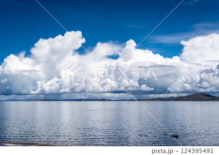 View of Lake Titicaca from Llachon with distant islands and hills View of Lake Titicaca from Llachon with distant islands and hills 124395491