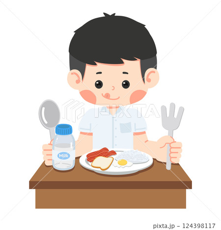 kid student is sitting at the table 124398117