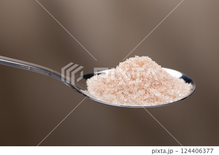 Close-up of Himalayan Pink Salt on a stainless steel spoon. 124406377