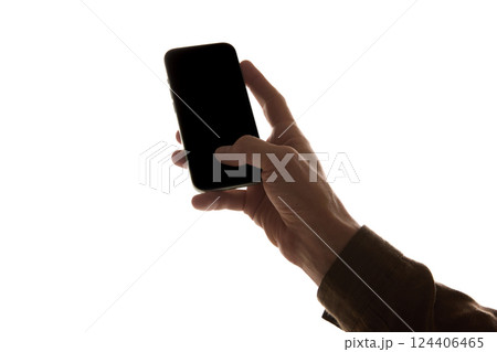 Male hand holding modern frameless smartphone with dark empty screen, against white background. Mockup Male hand holding modern frameless smartphone with dark empty screen, against white background. Mockup 124406465