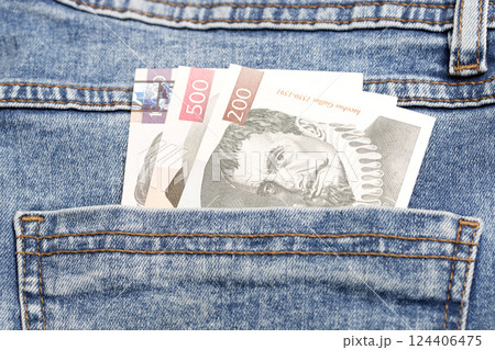 Slovenian Tolar in the pocket of blue jeans 124406475