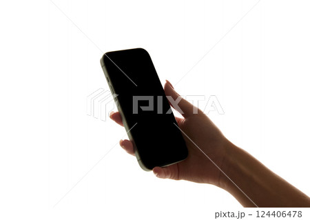 Hand holding smartphone with blank, dark screen against white background. Mockup. Ads, design Hand holding smartphone with blank, dark screen against white background. Mockup. Ads, design 124406478