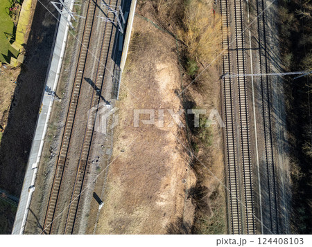 A Stunning Aerial View of Railway Tracks Intertwined with the Surrounding Landscape 124408103
