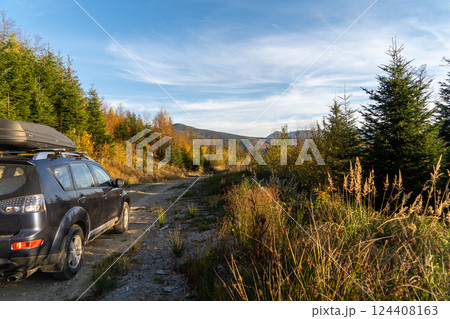 car for traveling with a mountain road 124408163