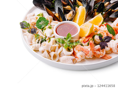 Fresh seafood platter with shrimp, mussels, and sauce served Fresh seafood platter with shrimp, mussels, and sauce served 124411658