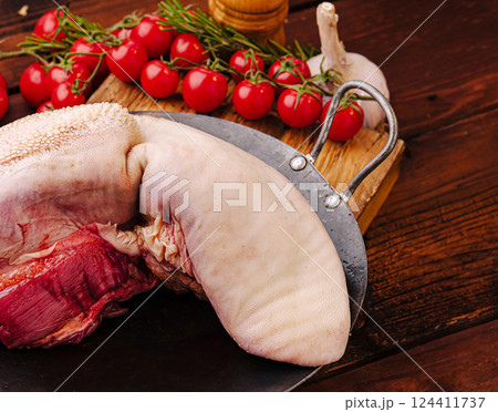 Preparing ingredients for traditional cooking with meat and tomatoes 124411737