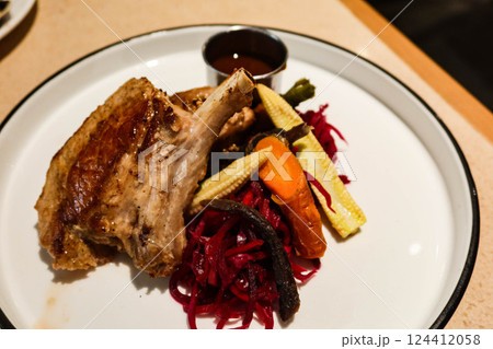 close up of grilled lamb meat mutton drumstick rack on a green plate with copy space close up of grilled lamb meat mutton drumstick rack on a green plate with copy space 124412058