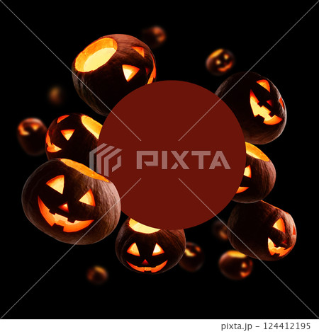 Glowing pumpkins levitate on a black background Glowing pumpkins levitate on a black background 124412195