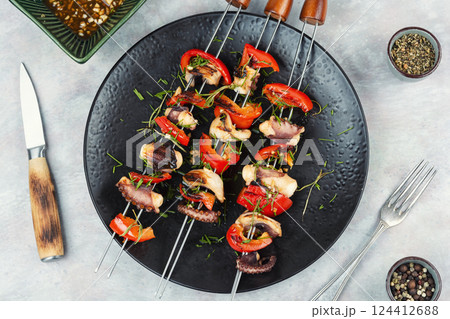Octopus skewers grilled. 124412688
