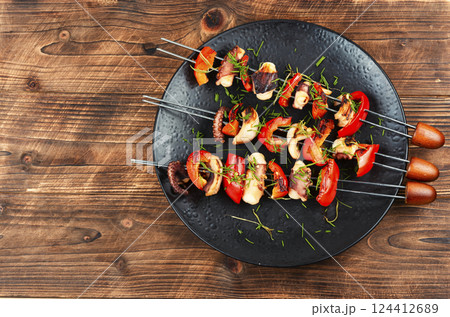Grilled octopus on skewers. 124412689