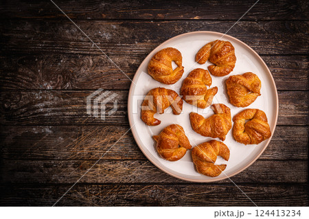 Homemade freshly baked in oven mini croissants Homemade freshly baked in oven mini croissants 124413234