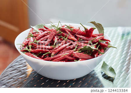 Pickled red hot peppers in a ceramic dish. Pickled red hot peppers in a ceramic dish. 124413384