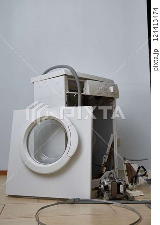 Washing machine repair. Disassembled washing machine. Close-up. Copy space. 124413474