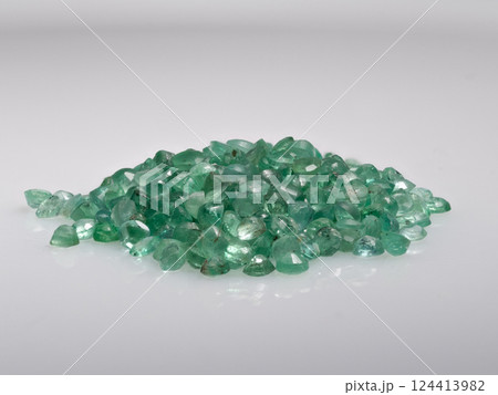Precise Pile of Radiant Natural Green Emerald Loose Gemstones Isolated on White Background 124413982