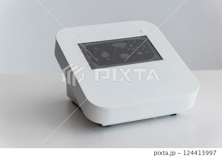 Modern Digital Laboratory Equipment Displaying Scientific Graphical Interface on Screen 124413997