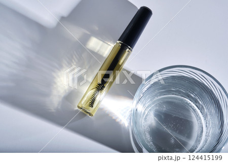 Bottle with brush filled with oil for eyebrow and eyelash growth. Bottle with brush filled with oil for eyebrow and eyelash growth. 124415199