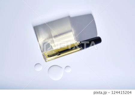 Bottle with brush filled with oil for eyebrow and eyelash growth.  124415204