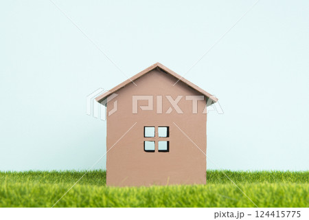 Model house on green grass concept of new building Model house on green grass concept of new building 124415775