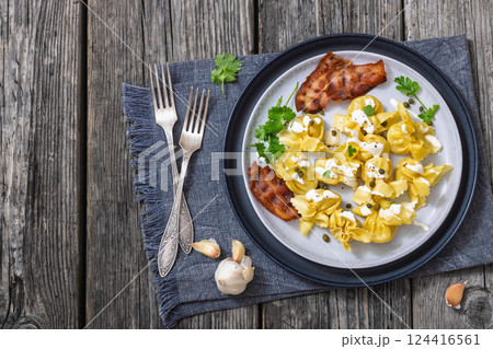 sacchettoni, pasta with bacon and cheese filling sacchettoni, pasta with bacon and cheese filling 124416561