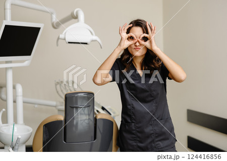Smiling female dentist looking at the camera in dental clinic 124416856