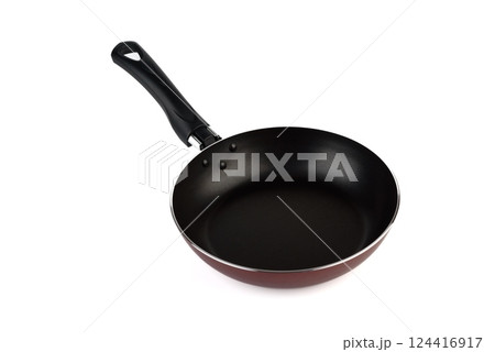 New kitchen frying pan with non-stick coating and black handle on white background. 124416917