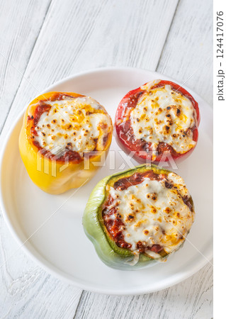 Juicy Baked Bell Peppers Stuffed with Flavorful Bolognese and Topped with Golden Mozzarella 124417076