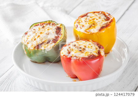 Juicy Baked Bell Peppers Stuffed with Flavorful Bolognese and Topped with Golden Mozzarella 124417079