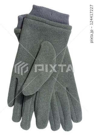 A pair of gray wool gloves with dark gray ribbed cuffs, isolated background 124417227