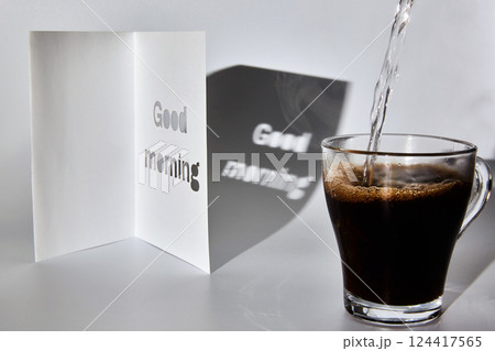 A cup of coffee and a good morning card 124417565