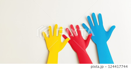 Three colorful hands symbolizing unity and diversity 124417744
