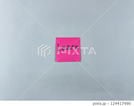 Sticky note on white background with word Learn. Concept of continuous learning and personal development. Development and acquisition of new information through learning Sticky note on white background with word Learn. Concept of continuous learning and personal development. Development and acquisition of new information through learning 124417990