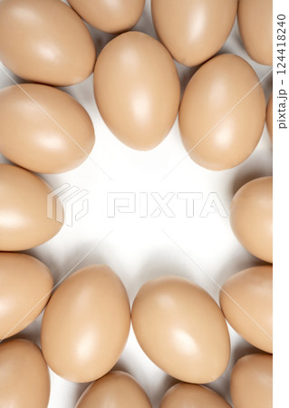 Top view of easter eggs on a white background. Copy space. Concept of celebrating the easter holiday Top view of easter eggs on a white background. Copy space. Concept of celebrating the easter holiday 124418240