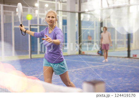 European woman playing padel European woman playing padel 124419170
