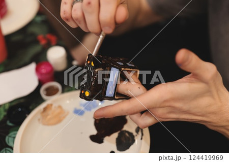 Engaging in Creative Hand Painting Using Vibrant and Captivating Colors for Expression 124419969