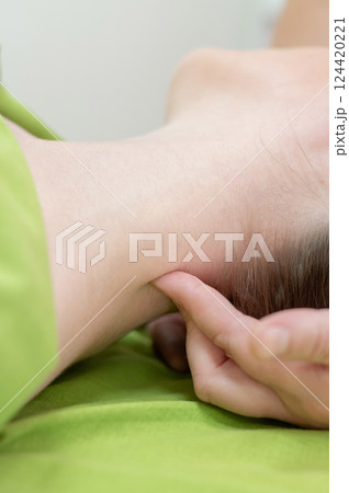 Caucasian woman on manual neck and head massage.  124420221
