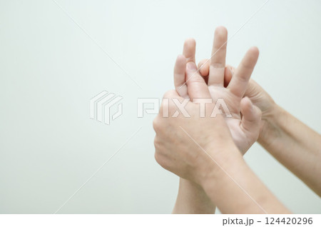 Close-up of female hands during massage. Close-up of female hands during massage. 124420296